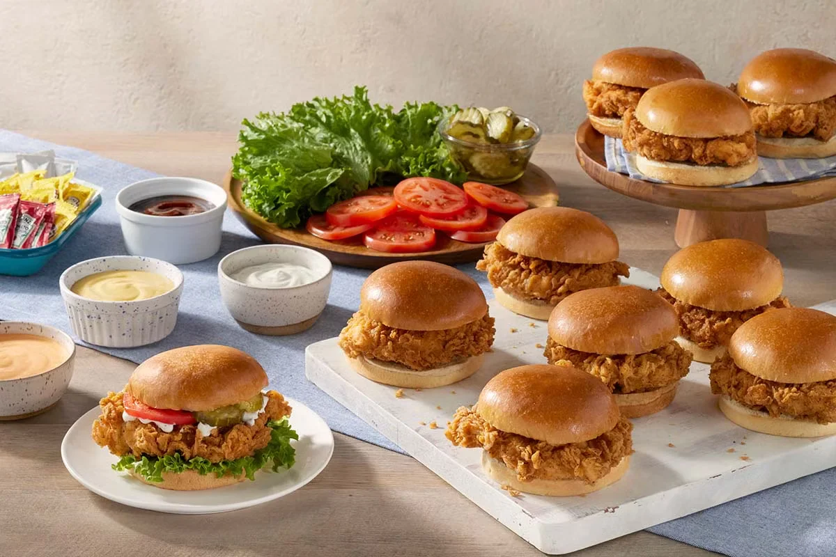 Cracker Barrel's Build Your Own Fried Saucy Chicken Sandwich Bar with crispy chicken, sauces, toppings, and buns.