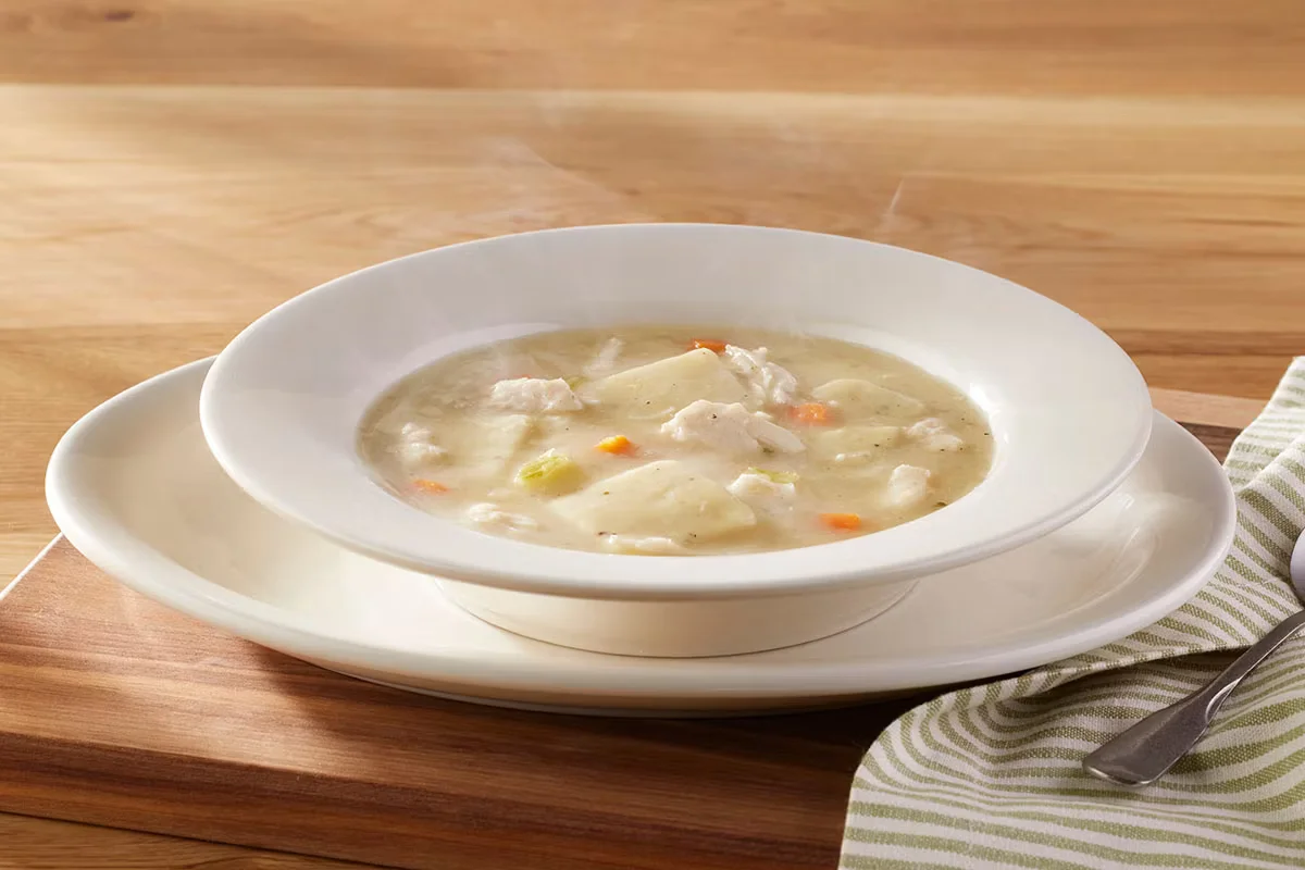Cracker Barrel's Chicken n' Dumplin Soup Bowl with tender chicken, soft dumplings, and creamy broth.