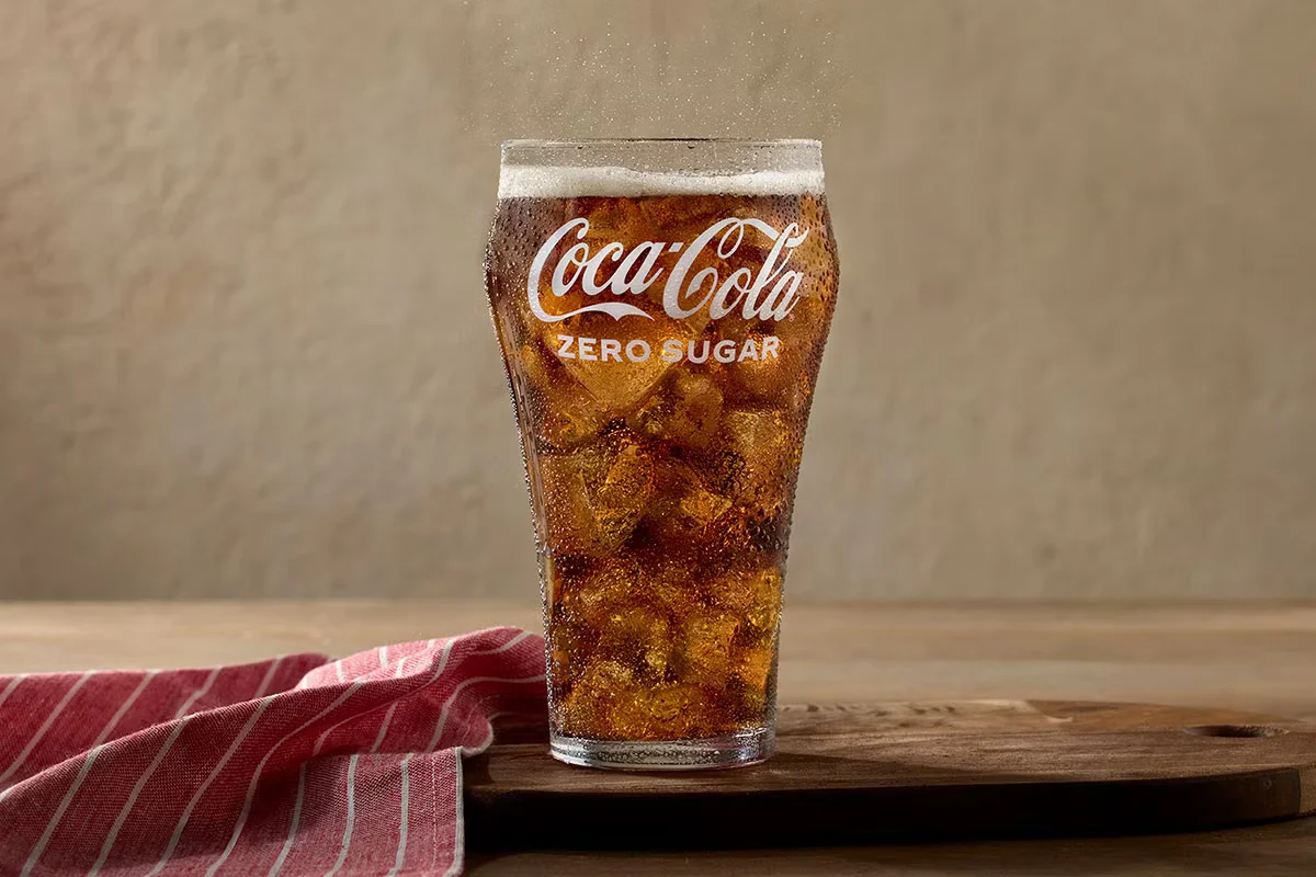A chilled bottle of Coca-Cola® Zero Sugar served at Cracker Barrel, offering the classic Coke flavor without sugar.