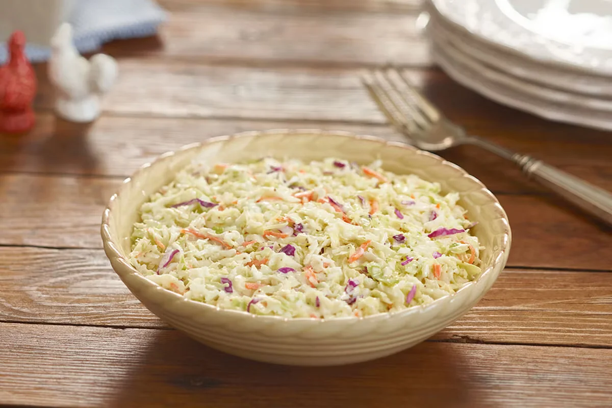 Cracker Barrel's creamy cole slaw made with fresh cabbage and carrots in a tangy dressing.