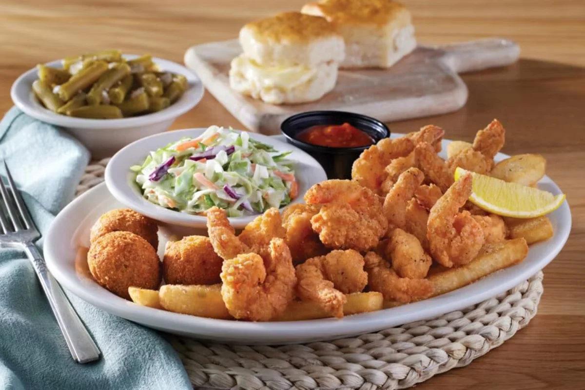 Cracker Barrel's Country Fried Shrimp, crispy golden-fried shrimp served with tangy cocktail sauce and homestyle sides.
