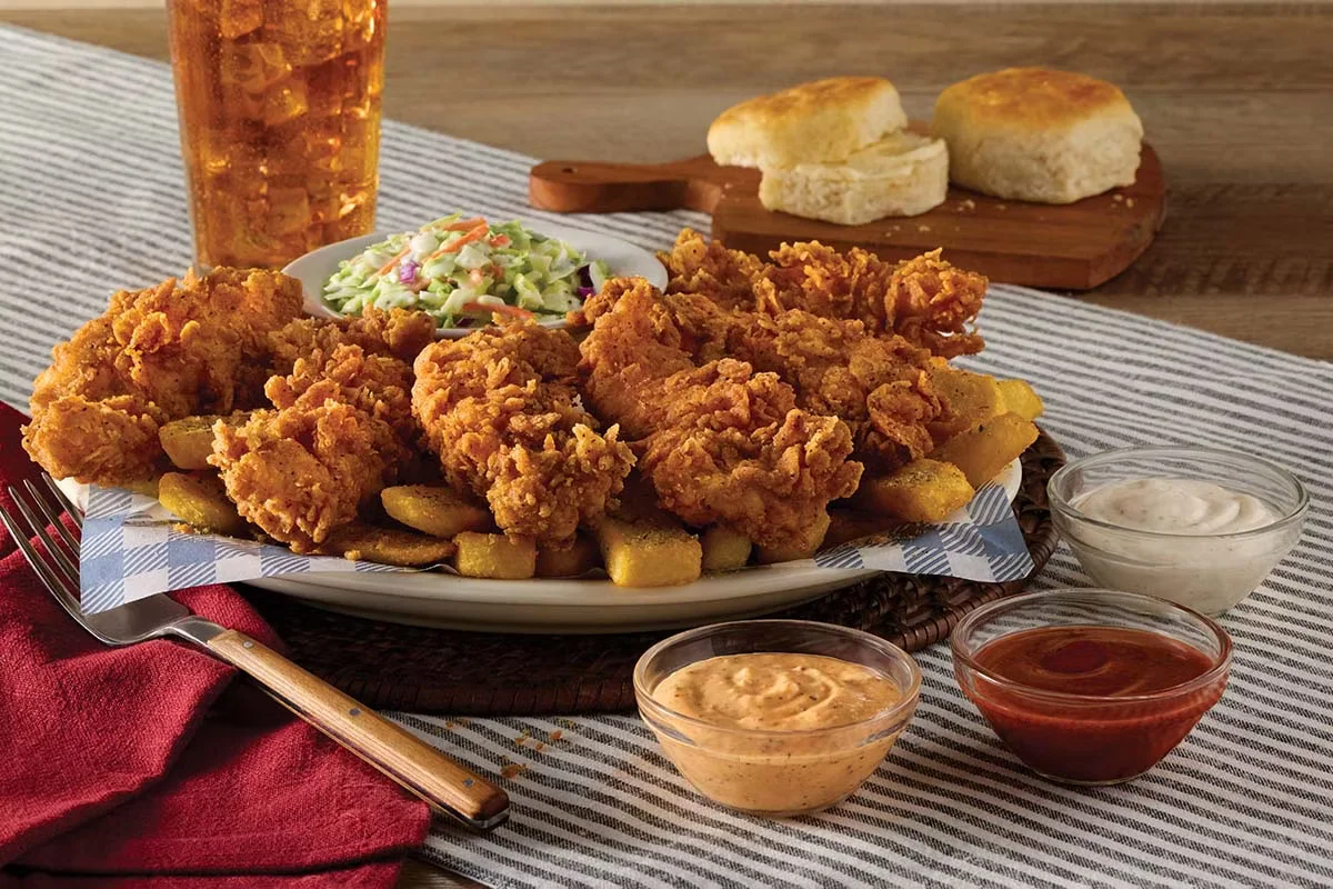 Crispy Tender Dippers served with golden breading and a side of dipping sauce from Cracker Barrel.