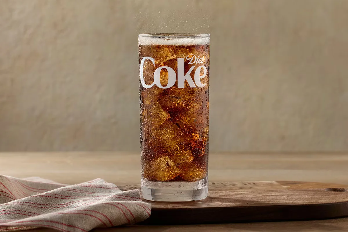 A chilled bottle of Diet Coke served at Cracker Barrel, offering a refreshing, sugar-free soda option.