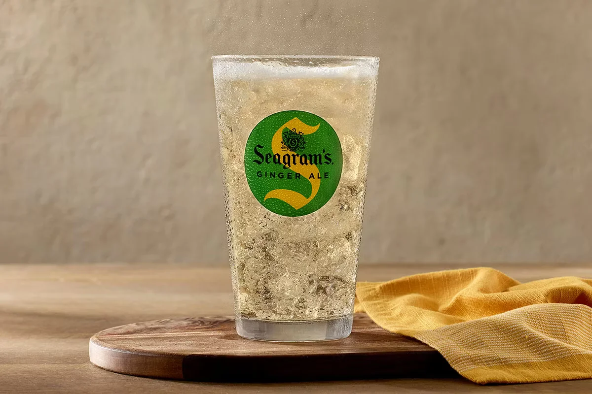 A chilled bottle of Ginger Ale served at Cracker Barrel, offering a crisp and refreshing soda with a hint of ginger.