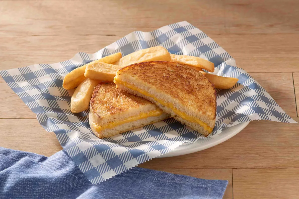 Cracker Barrel's Grilled Cheese Sandwich, featuring melted cheese between two golden, buttery slices of bread.