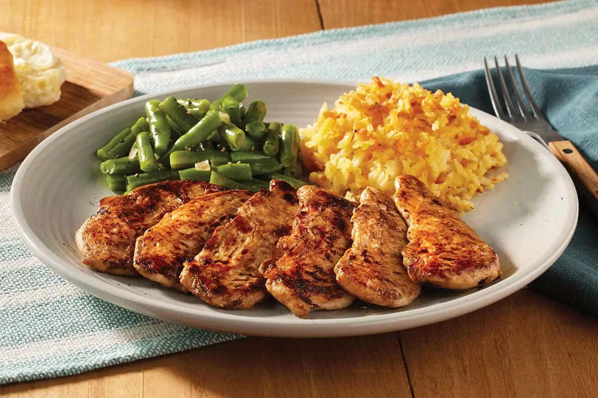 Cracker Barrel's Grilled Chicken Tenders, seasoned and juicy, served with classic homestyle sides.