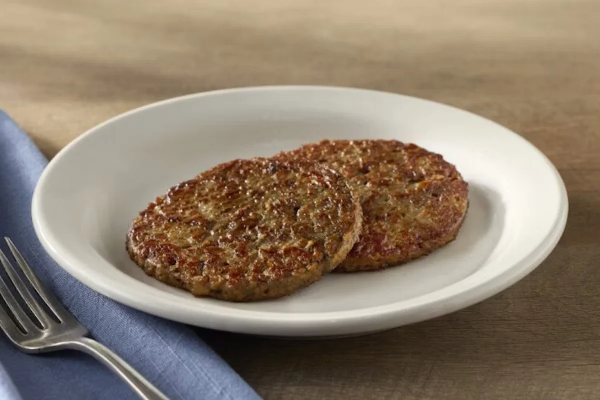 Cracker Barrel's Impossible Sausage, a plant-based sausage patty served as a savory and sustainable breakfast option.