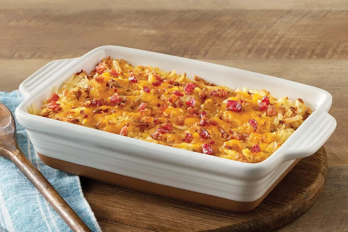 Cracker Barrel's Loaded Hashbrown Casserole with melted cheese, crispy bacon, and golden hashbrowns.