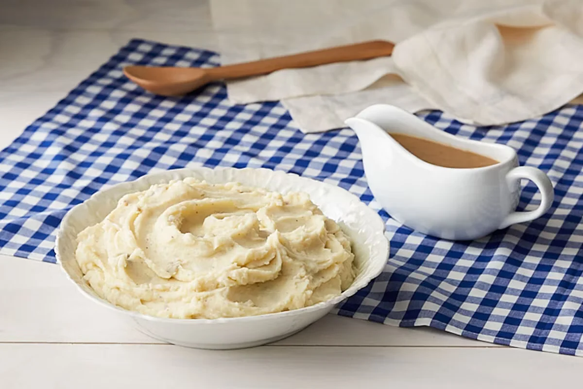 Cracker Barrel's creamy mashed potatoes topped with rich brown gravy as a classic homestyle side.