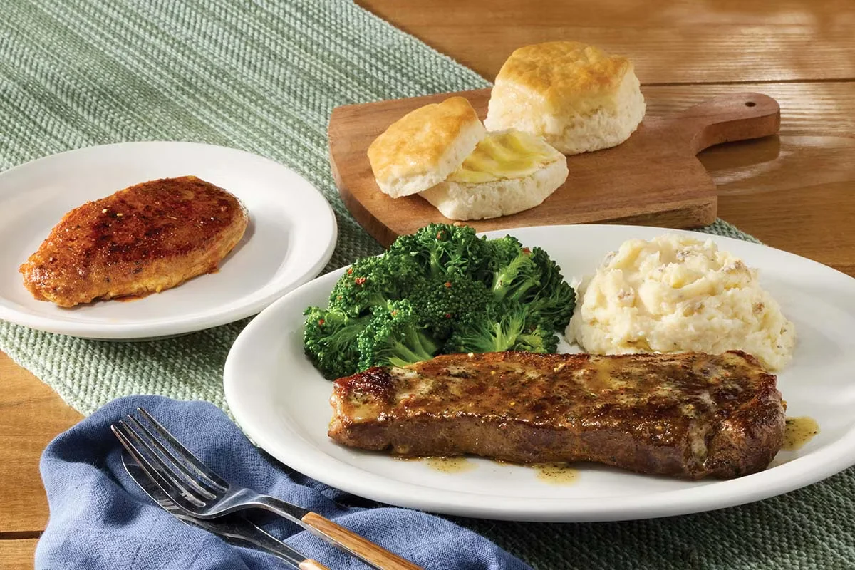 Cracker Barrel's New York Strip Steak n' Chicken Combo with tender steak, juicy chicken, and homestyle sides.