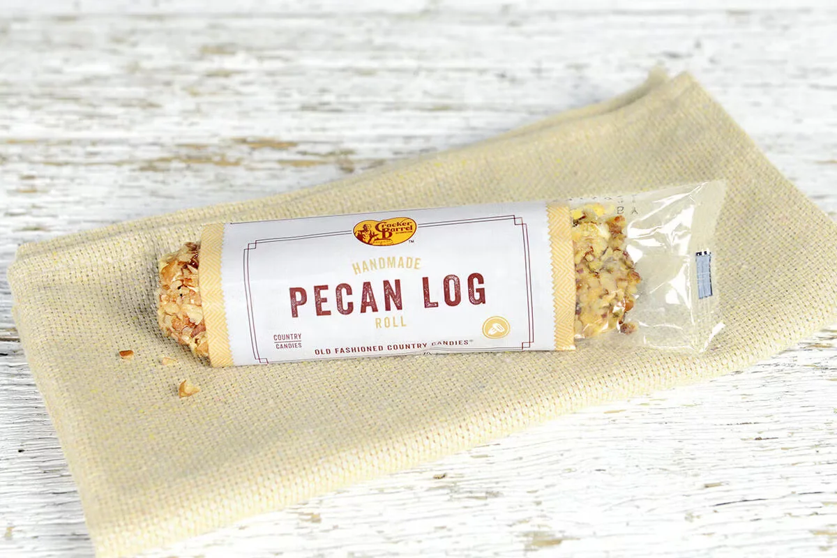 Cracker Barrel's Pecan Log, a 3oz. treat made with creamy nougat, caramel, and crunchy pecans.