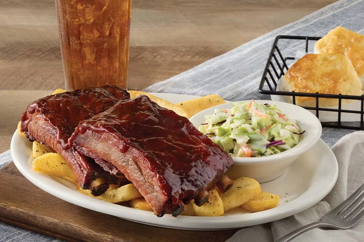 Cracker Barrel's Saturday Southern BBQ Ribs, tender and flavorful ribs glazed with sweet and tangy BBQ sauce, served with sides.