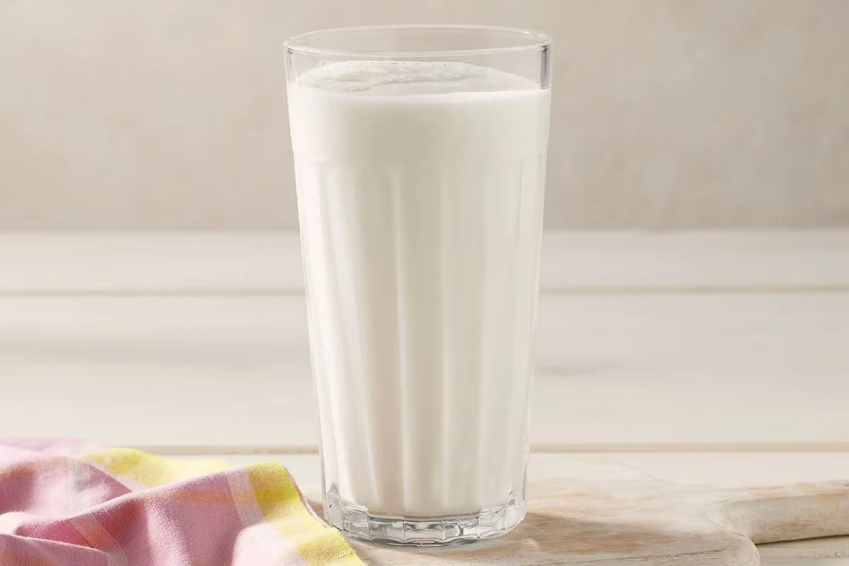 Cracker Barrel's Skim Milk, a cold and refreshing low-calorie beverage served in a classic glass.