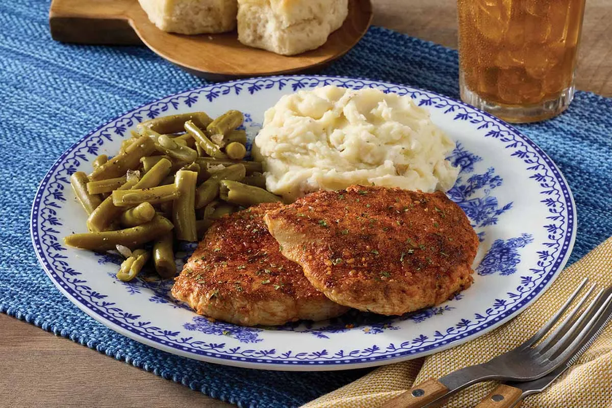 Cracker Barrel's Smoky Southern Grilled Chicken, seasoned and grilled to perfection, served with classic homestyle sides.